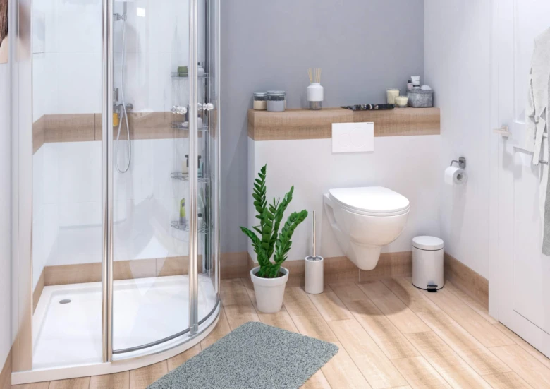 Moderní koupelna s sprchovým koutem na světlém dřevěném podlaze.