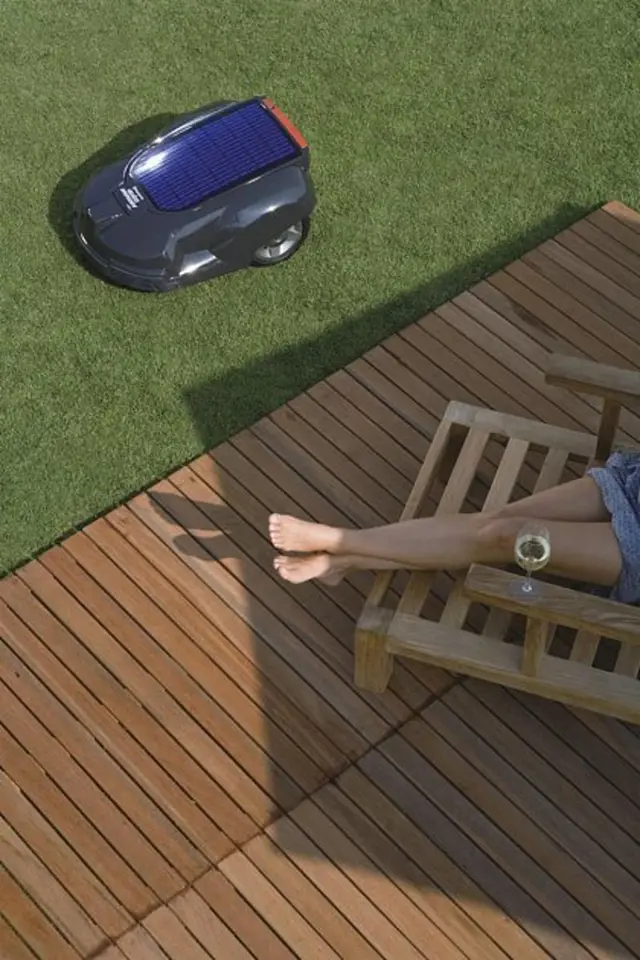Robotic lawnmower on grass