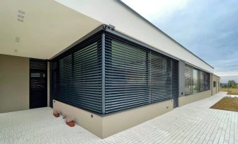 Exterior window shutters on modern house