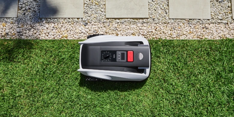 Robotic lawnmower on grass