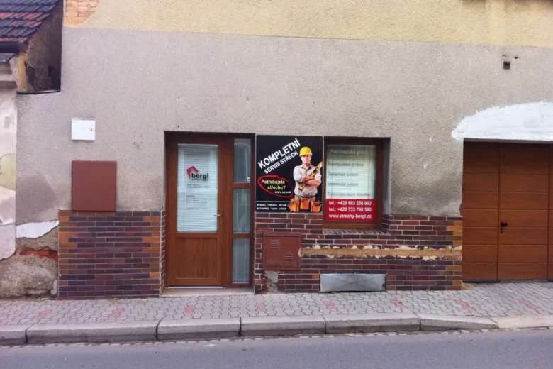 Roofing company storefront with ad
